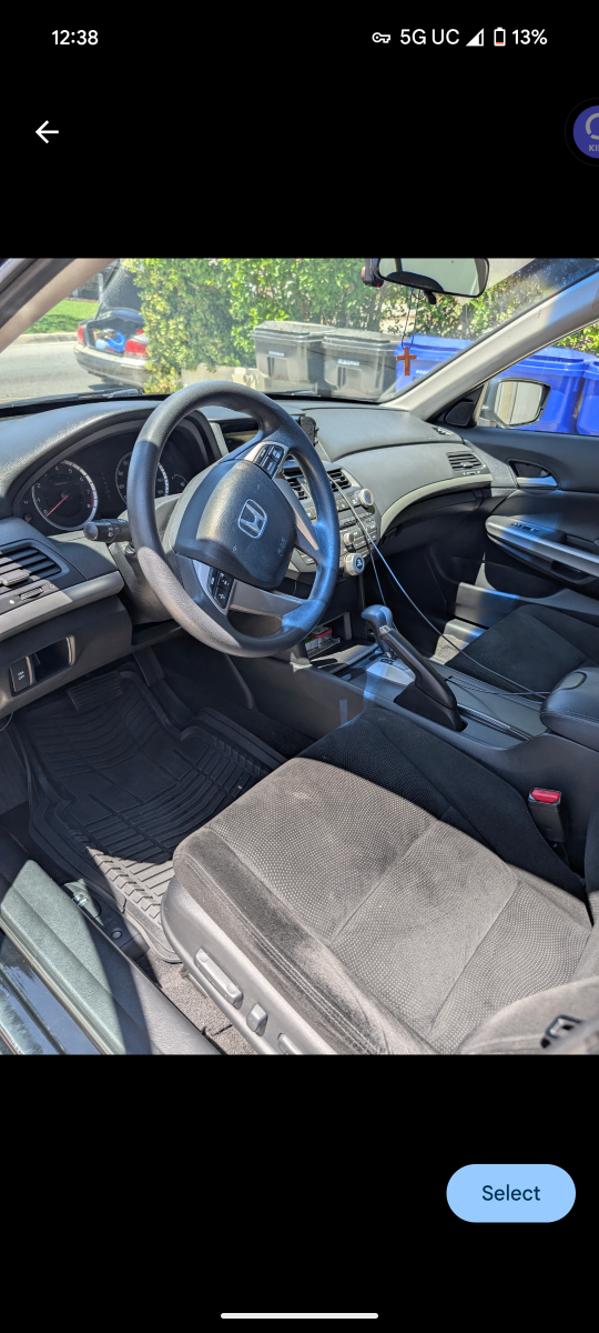 Professional interior detailing of Honda sedan showing pristine dashboard, steering wheel, center console, and fabric seat cleaning with complete attention to detail