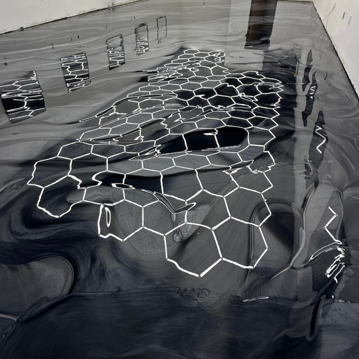 Luxury garage with metallic epoxy flooring