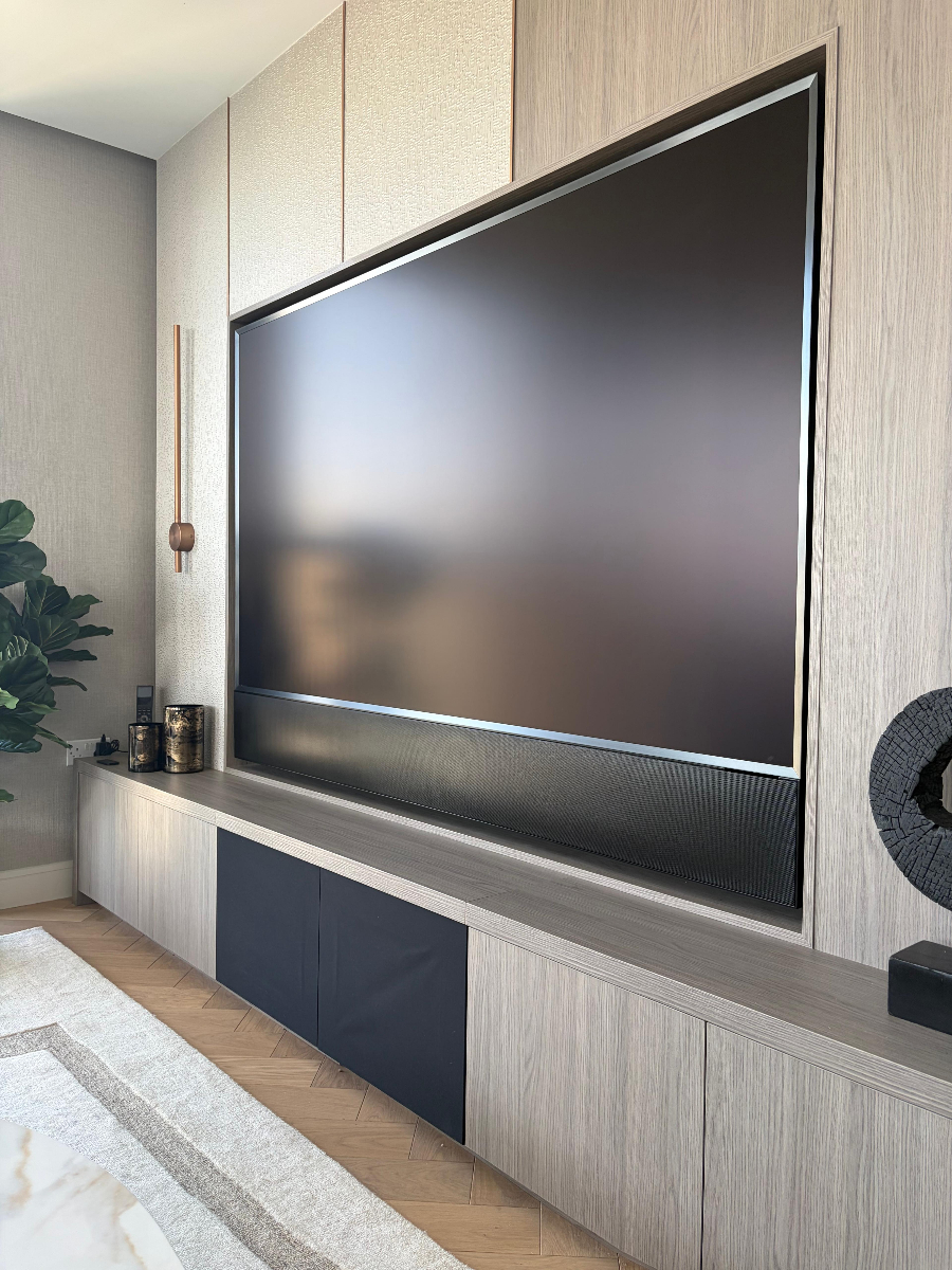 85-inch Samsung TV with James soundbar, subwoofer and 5.2 surround sound system powered by Control4