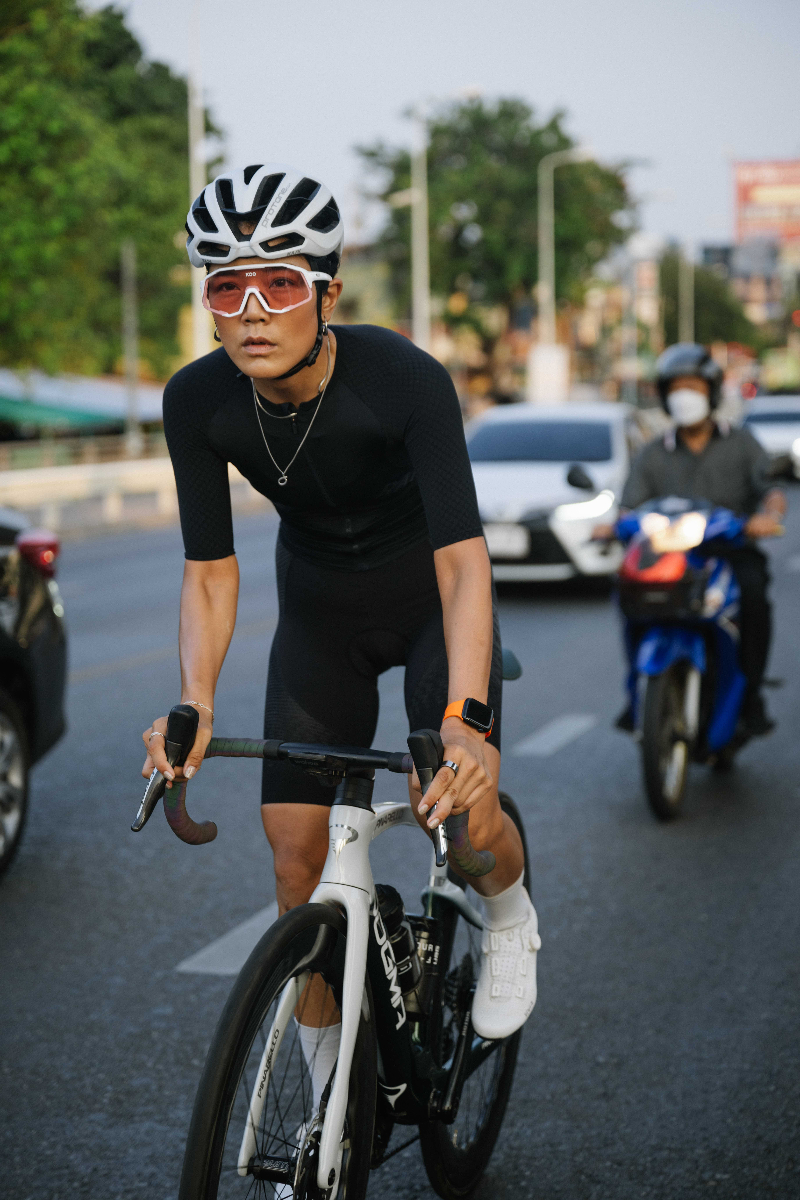 Gift Muzcali cycling on Thailand street with traffic