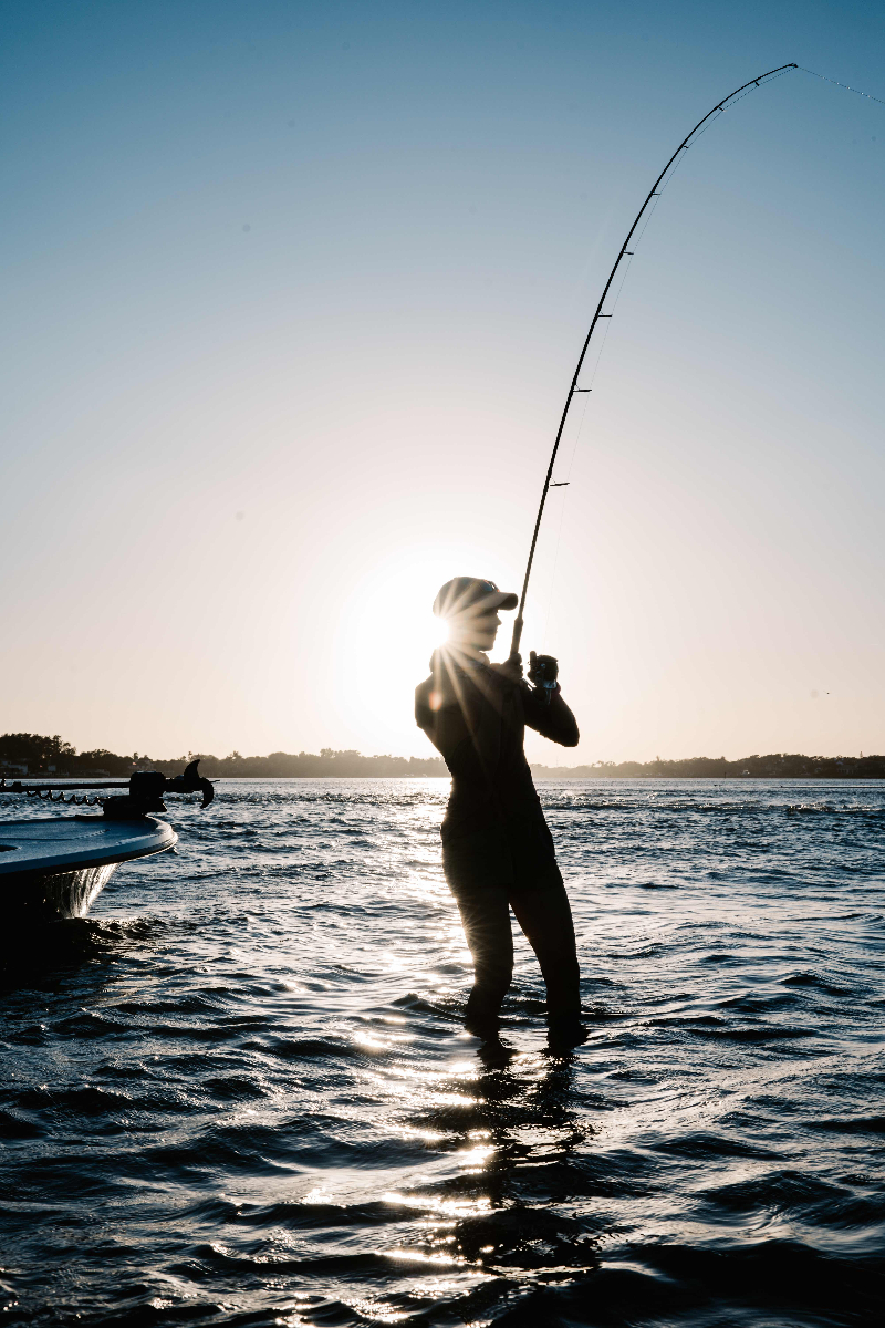 Allie fishing silhouette at sunset in Florida waters