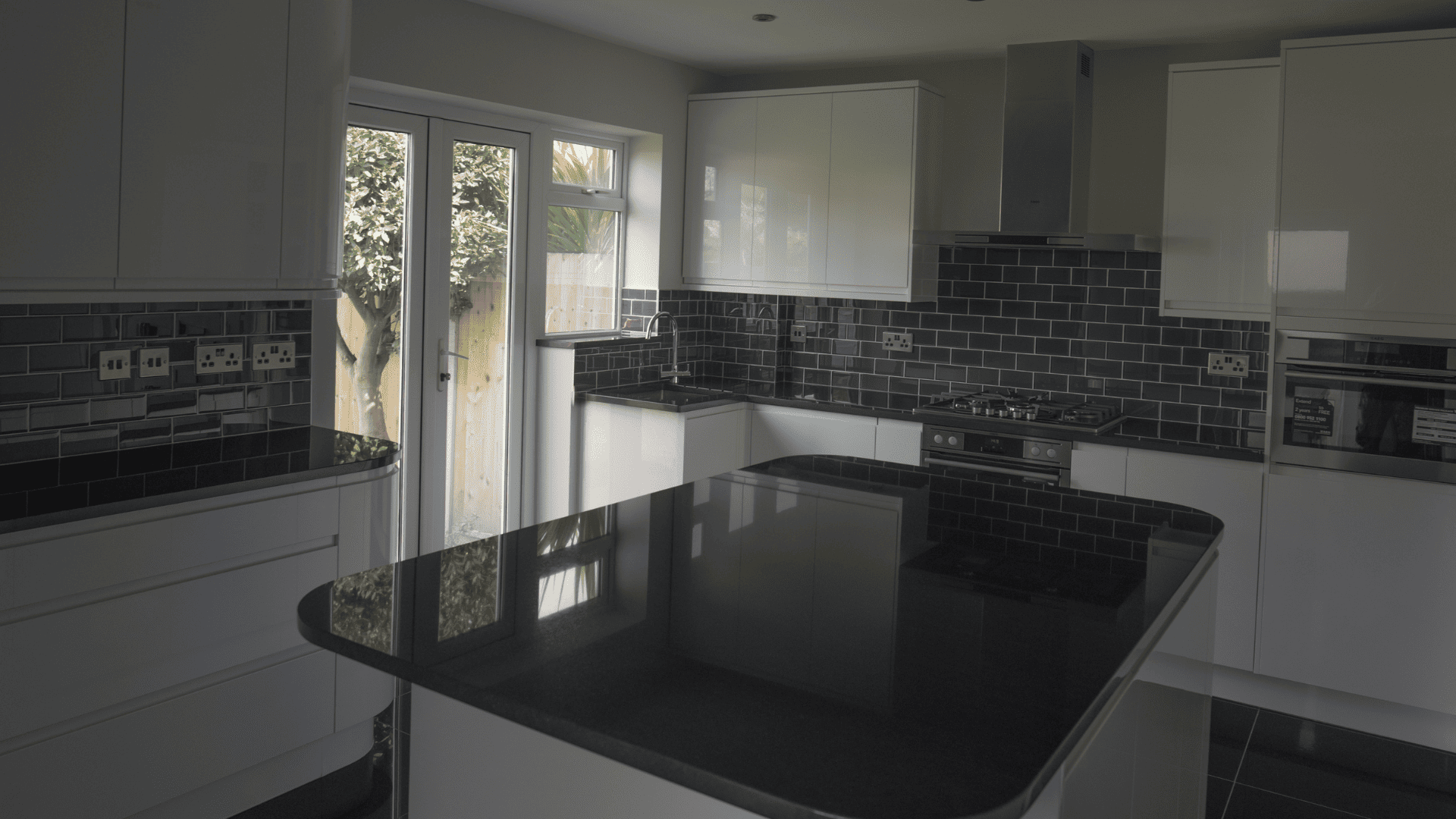 Kitchen with island in Weybridge