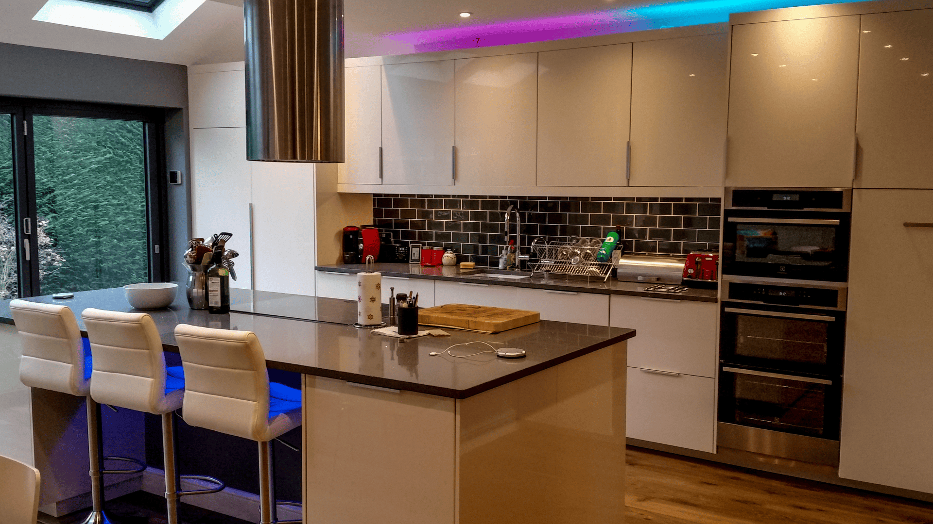 Modern kitchen with bi-fold doors in Esher
