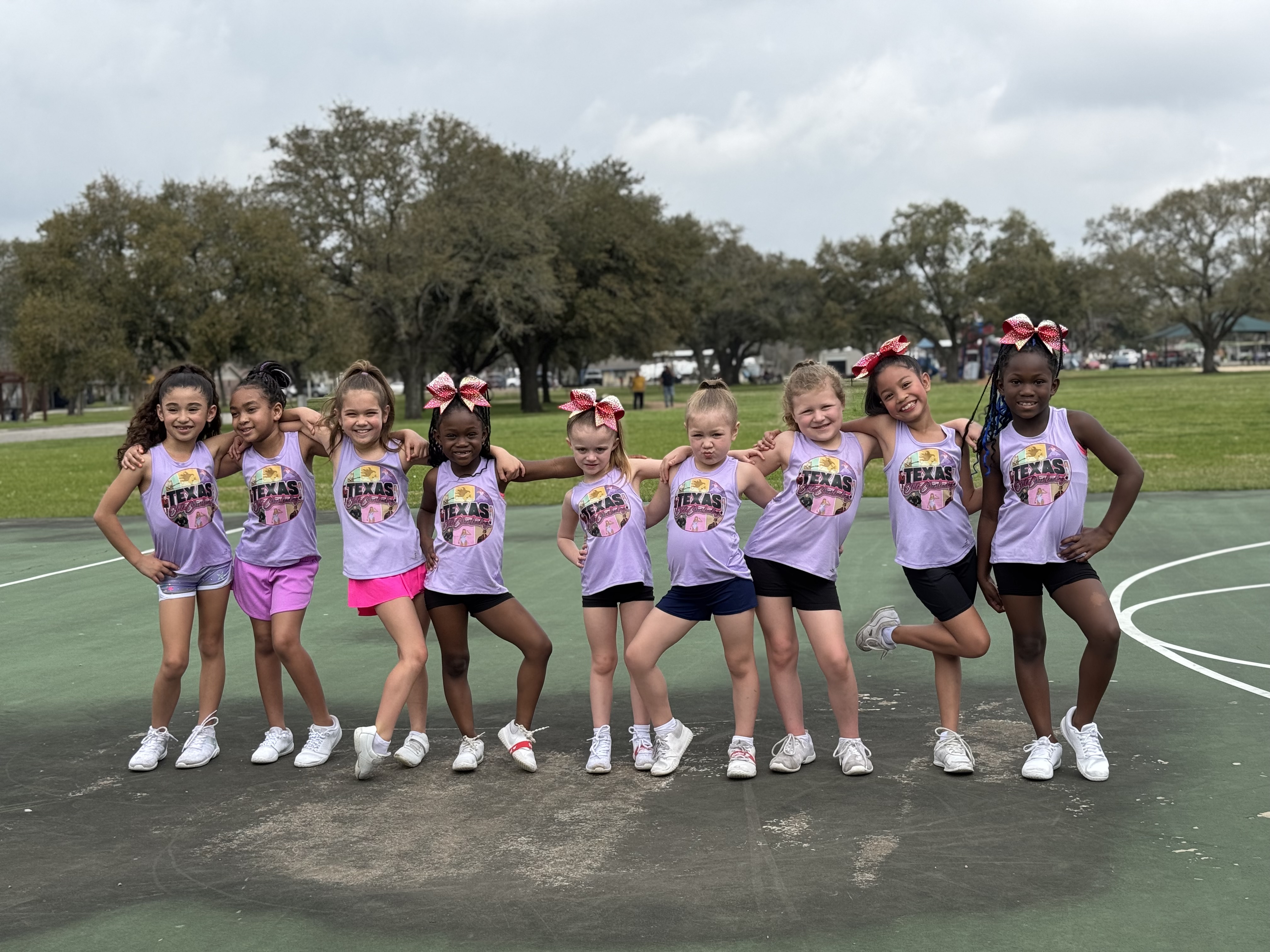 Texas Elite Cheerleading summer camp kids performing cheer routines outdoors