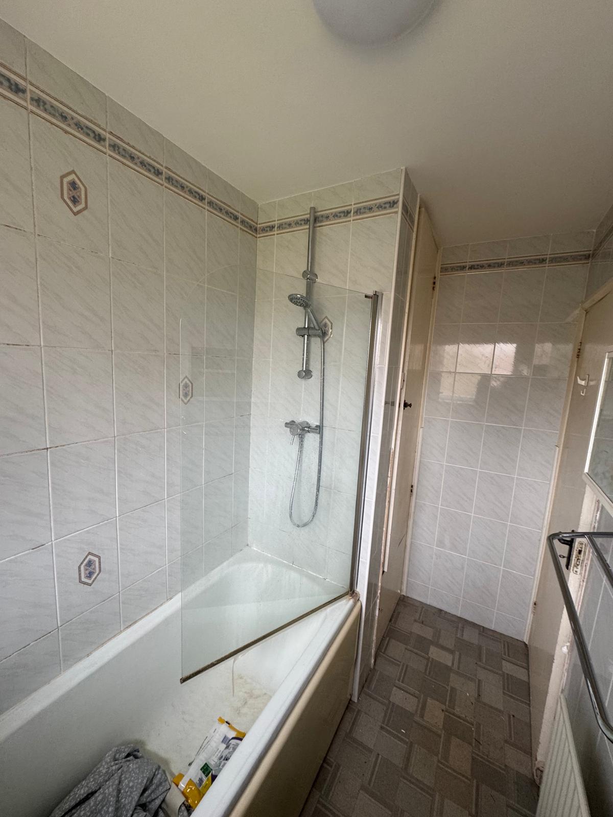 Wall panelling and plumbing installation in Goring bathroom