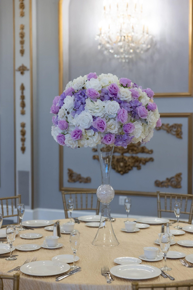 White Hydrangea and White and Lavender roses on Hourglass Vase