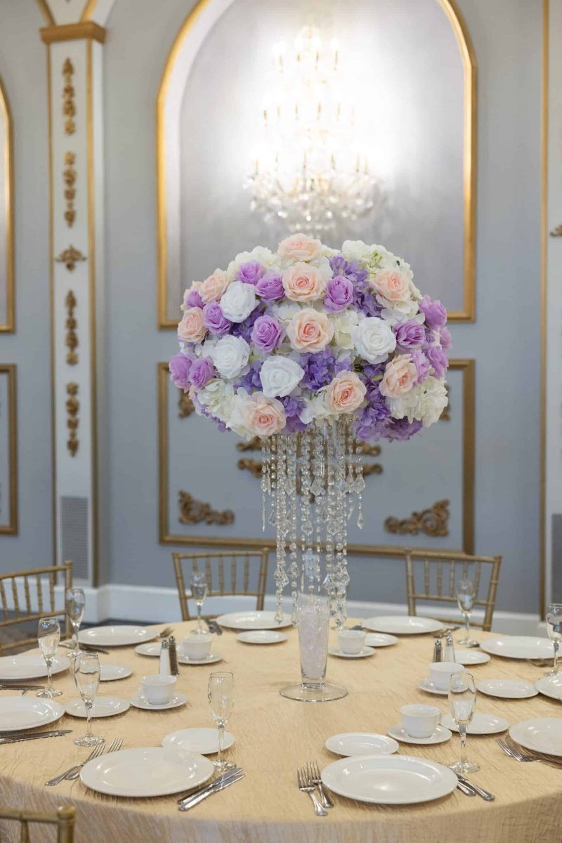 White Hydrangea with white, pink and lavender roses on Pilsner vase with Princess Chandelier