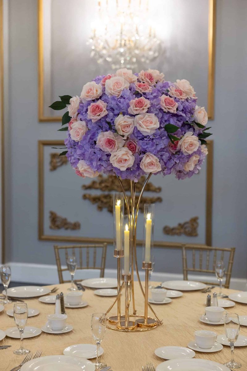 Lavender Hydrangea and Pink Roses on Gold Hourglass Stand with Gold Taper Candle Holders