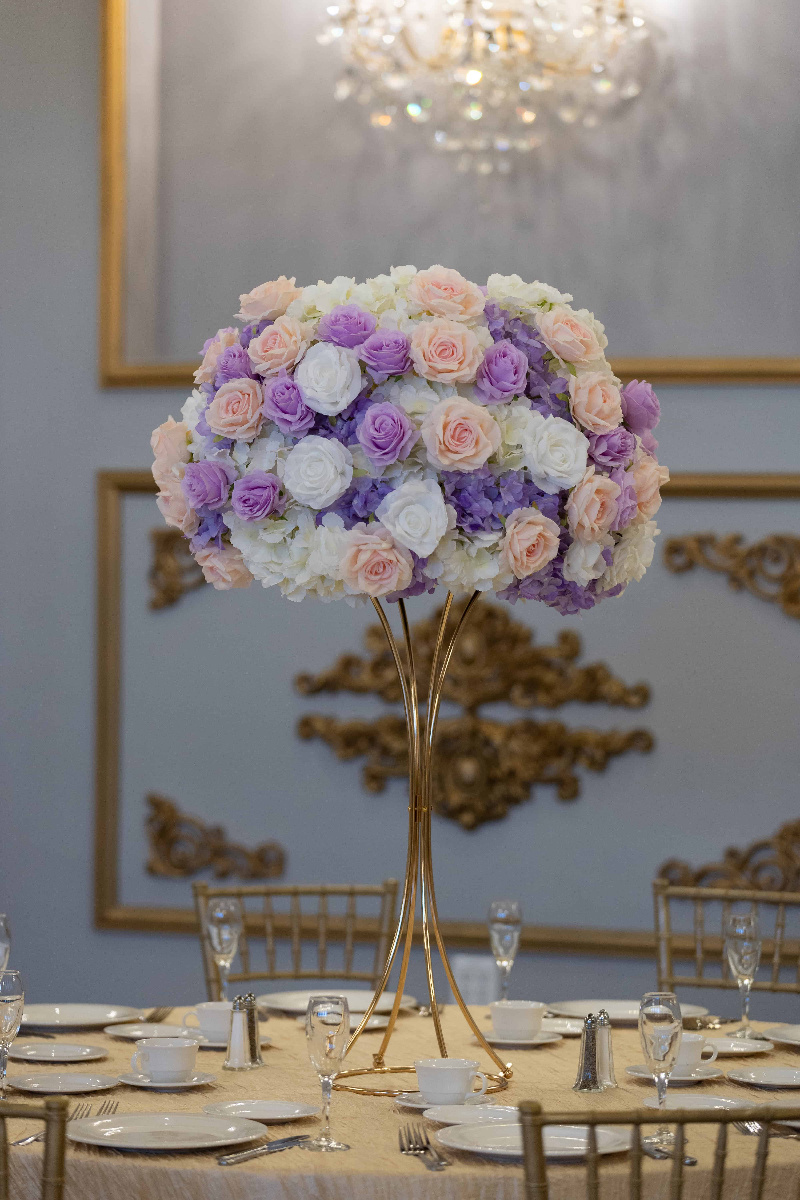 White Hydrangea with white, pink and lavender roses on gold hourglass stand