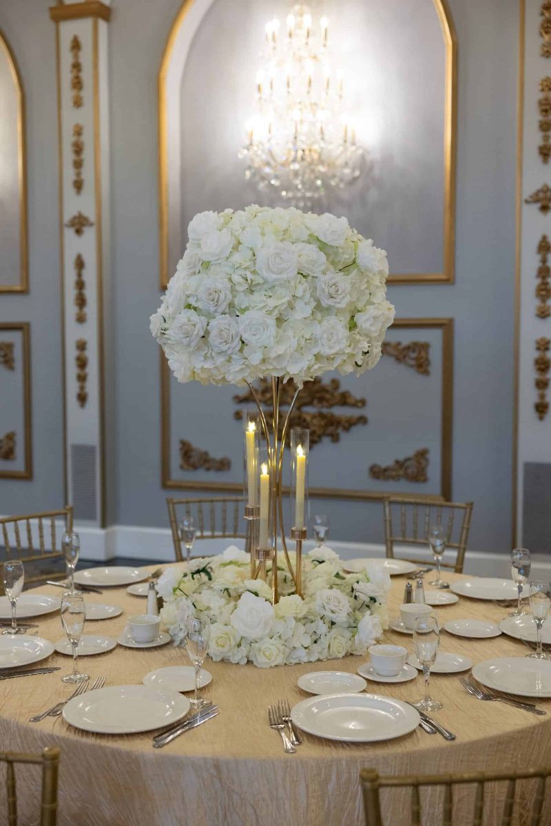 White Hydrangea and Rose On Gold Hourglass Stand with Gold Taper Candle Holders and Wreath