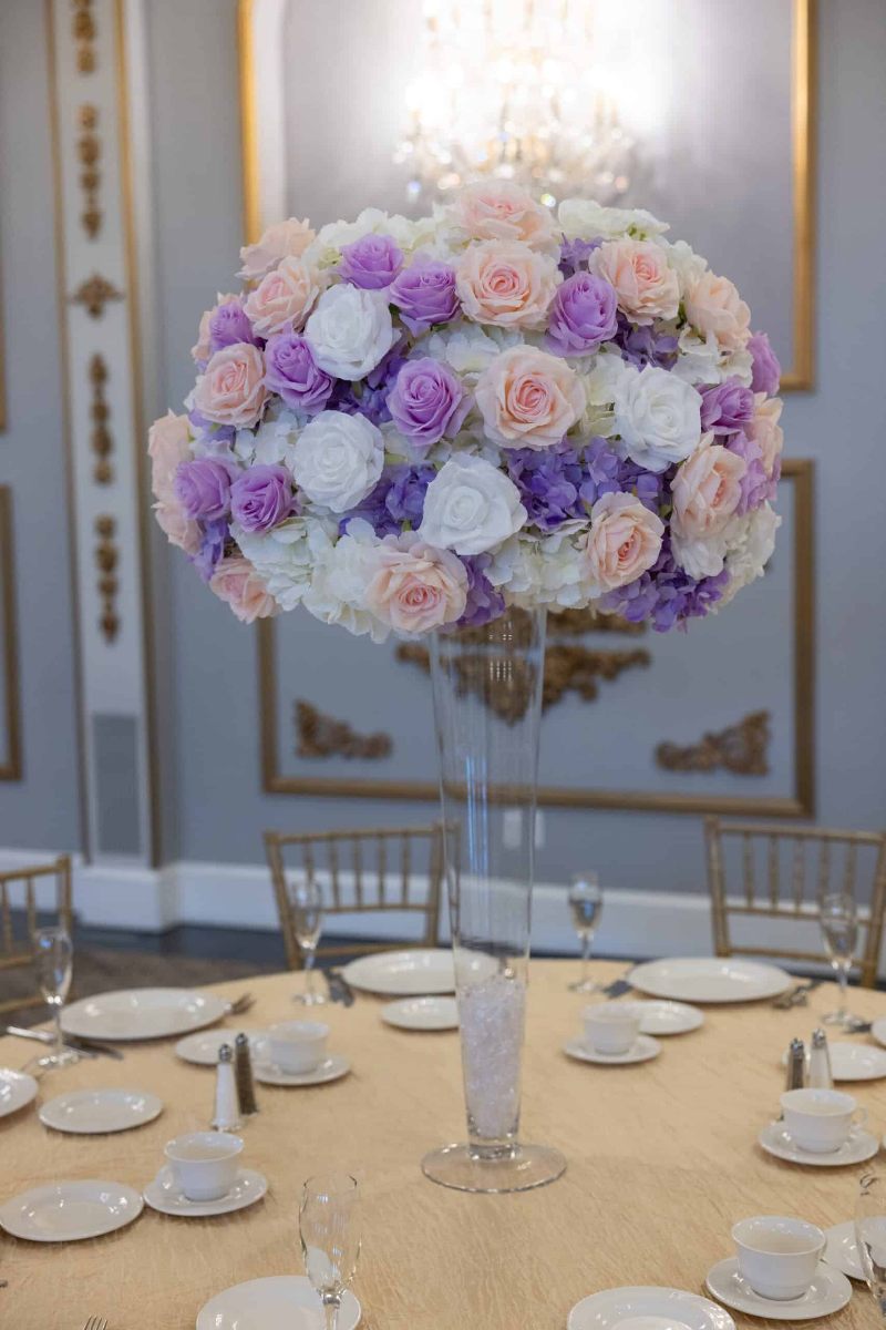 White Hydrangea with white, pink and lavender roses on pilsner vase