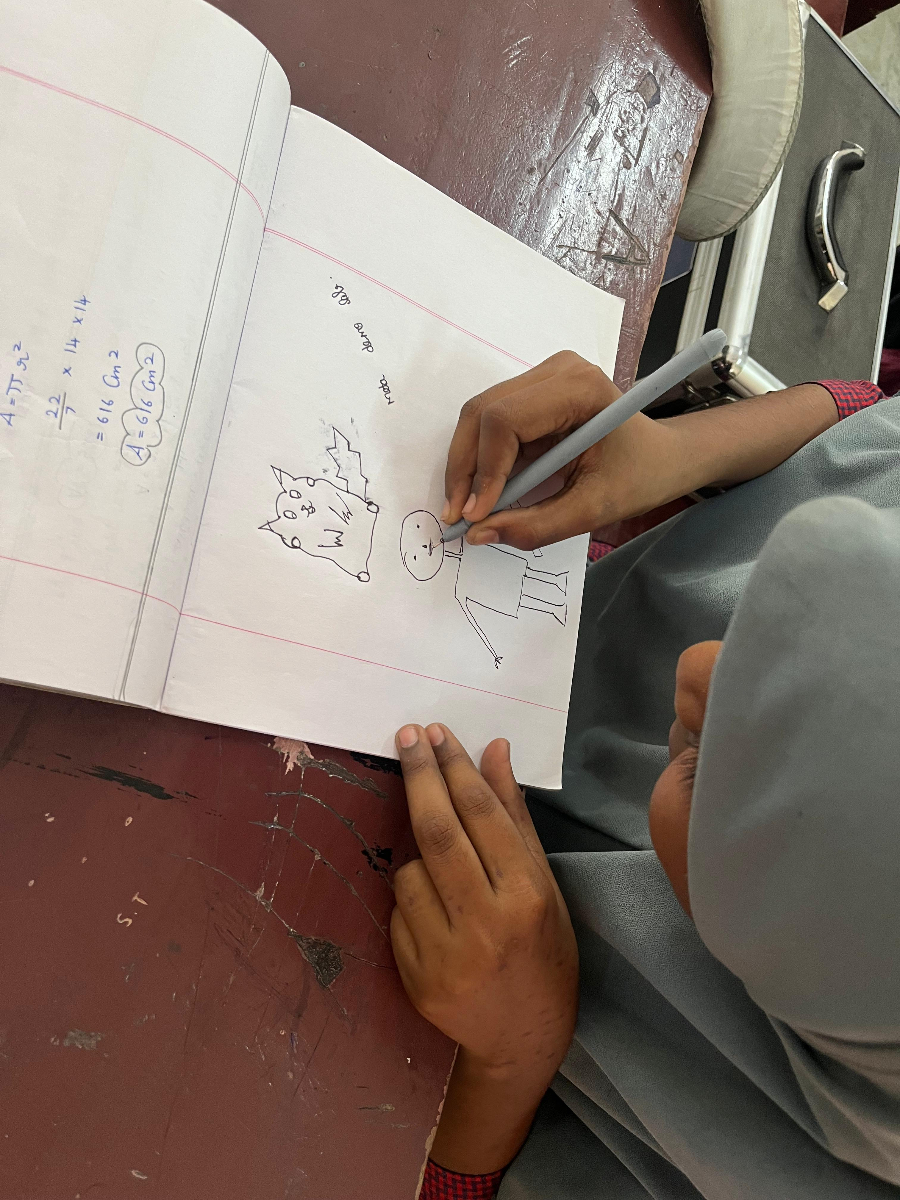 AI Craft Workshop — student sketching AI characters