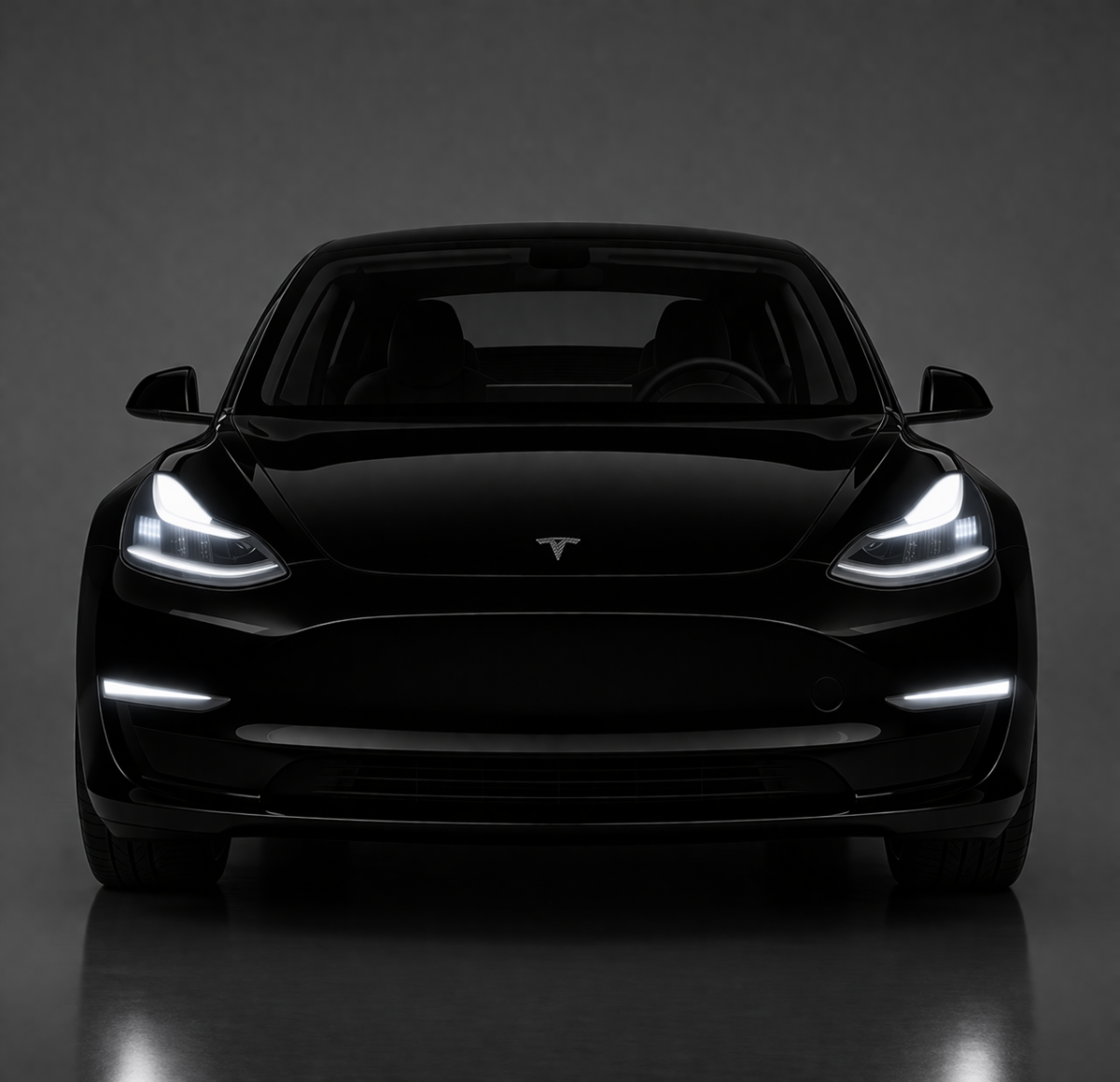 Tesla Model Y front view dramatic studio lighting