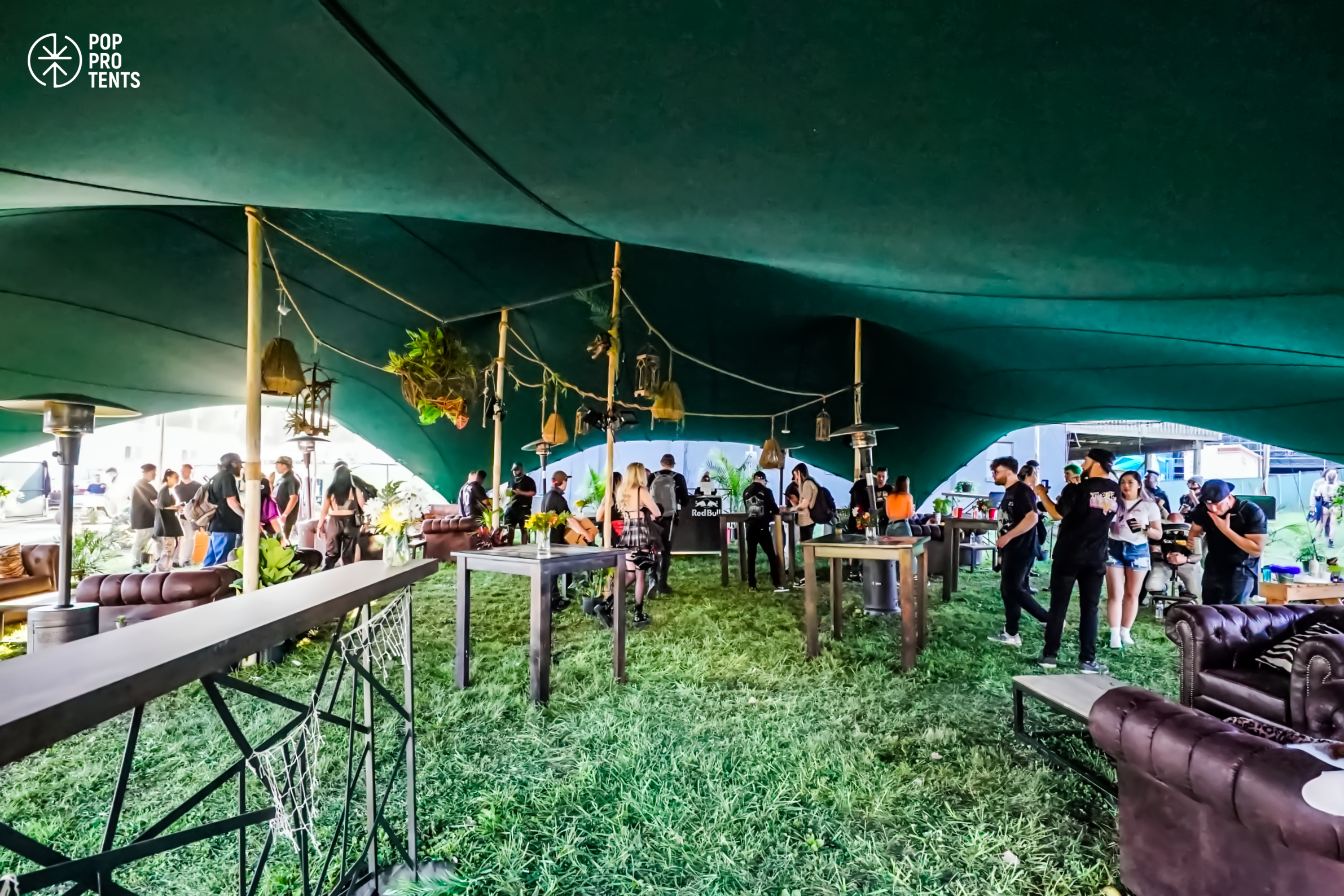 Bespoke floral ceiling installation under stretch tent