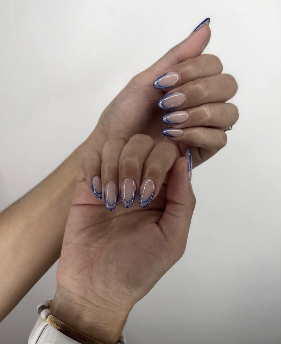 Nude and blue tipped nail design