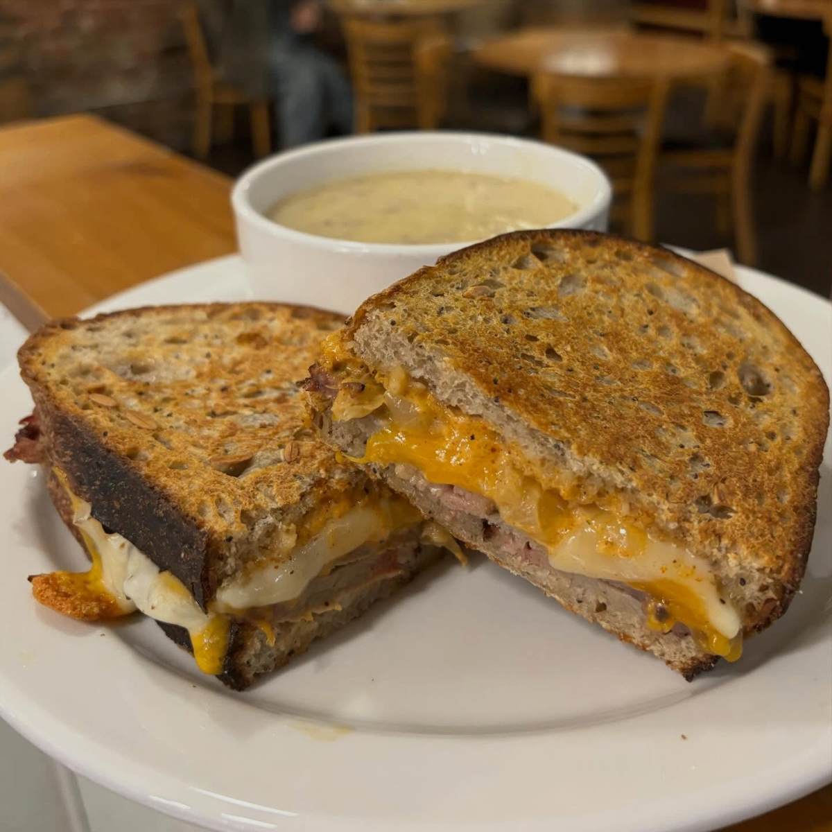 Grilled sandwich with melted cheese and soup
