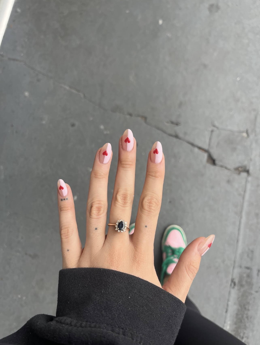 Pink nails with red heart designs