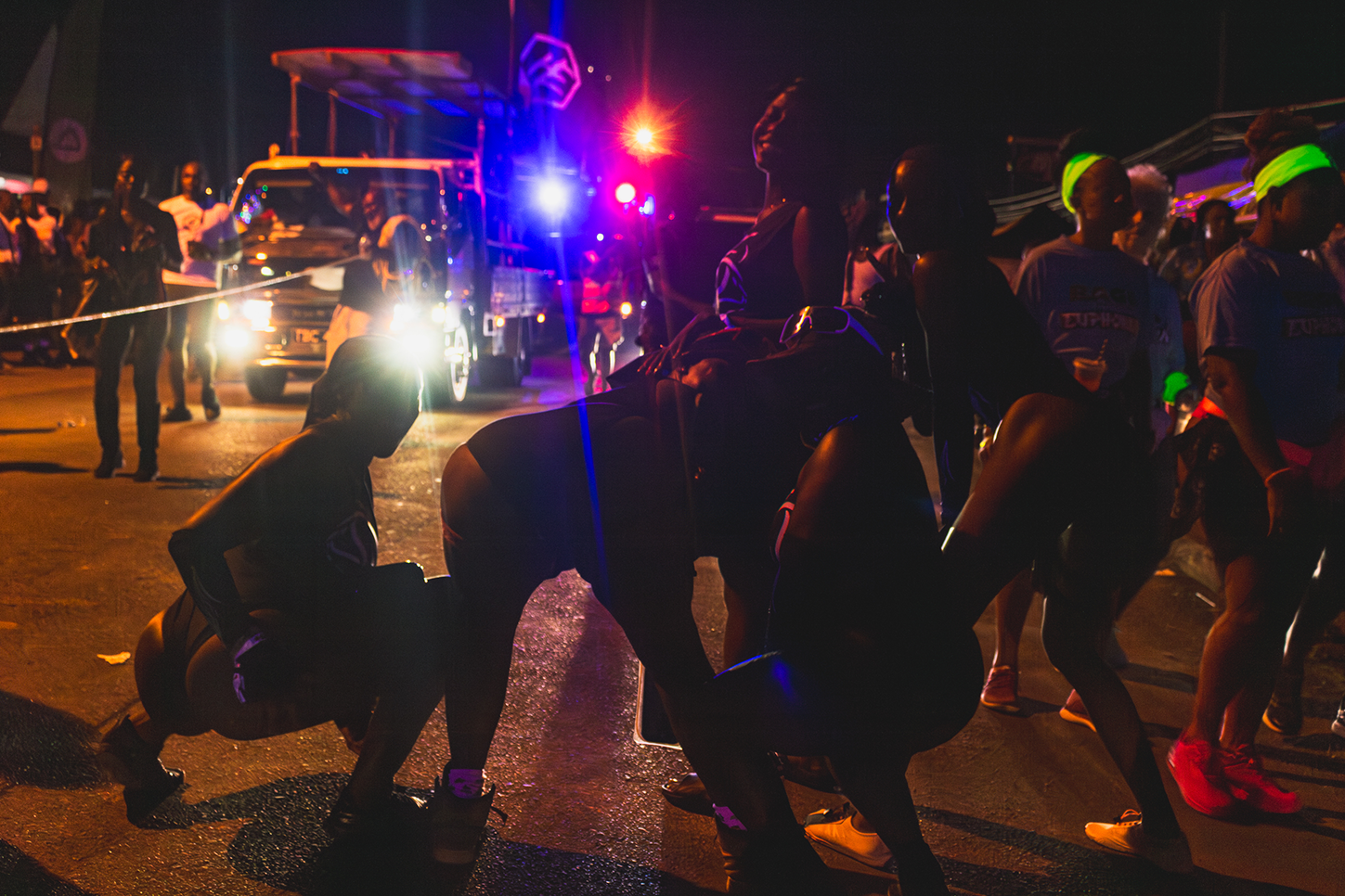 NEON Night Mas carnival masqueraders on the road