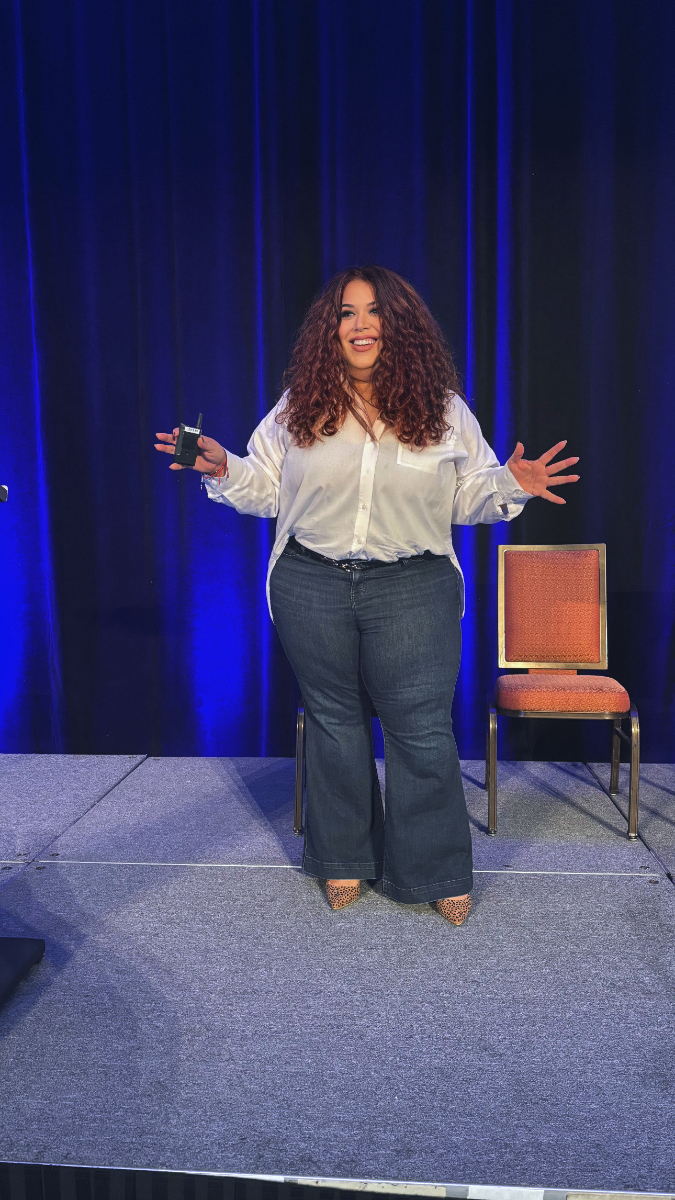 Julie Veloz speaking on stage