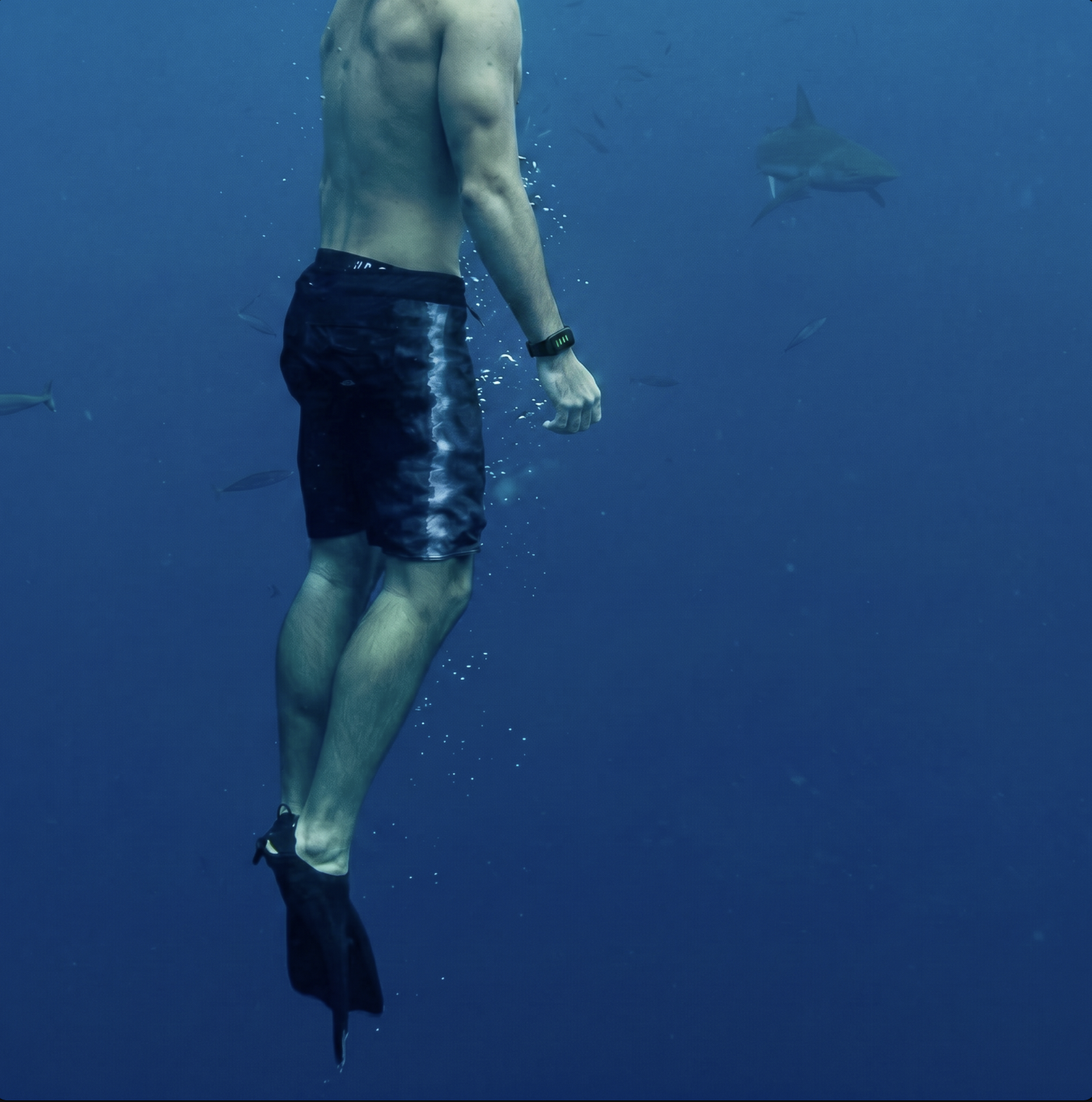 Freediver resting at the ocean surface at golden hour