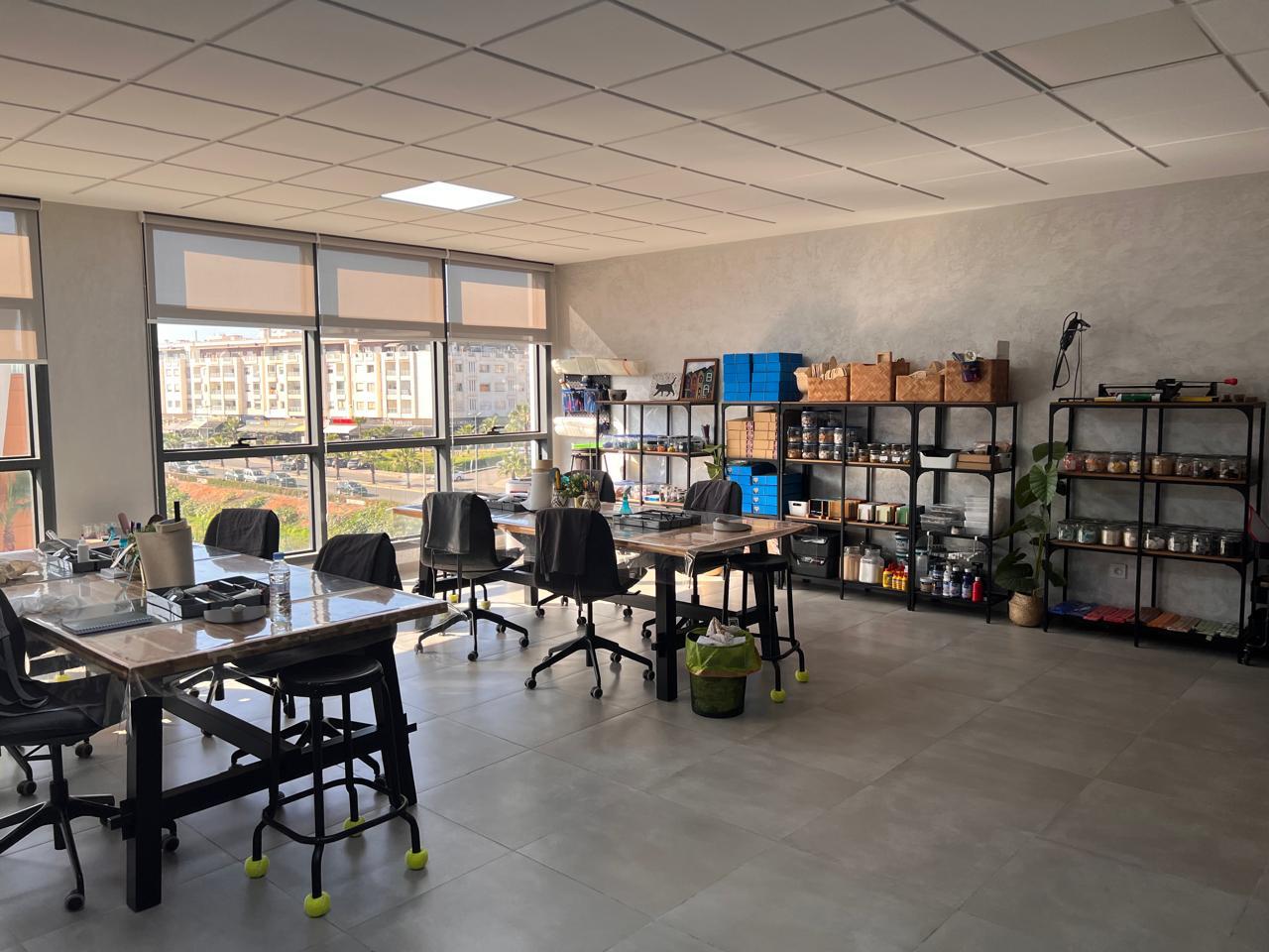 Panoramic view of Zaza Mosaic art studio workspace with warm terracotta walls