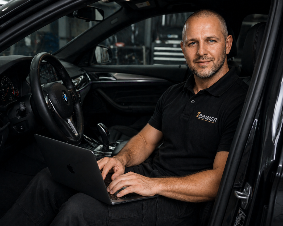 1Bimmer technician coding BMW in car