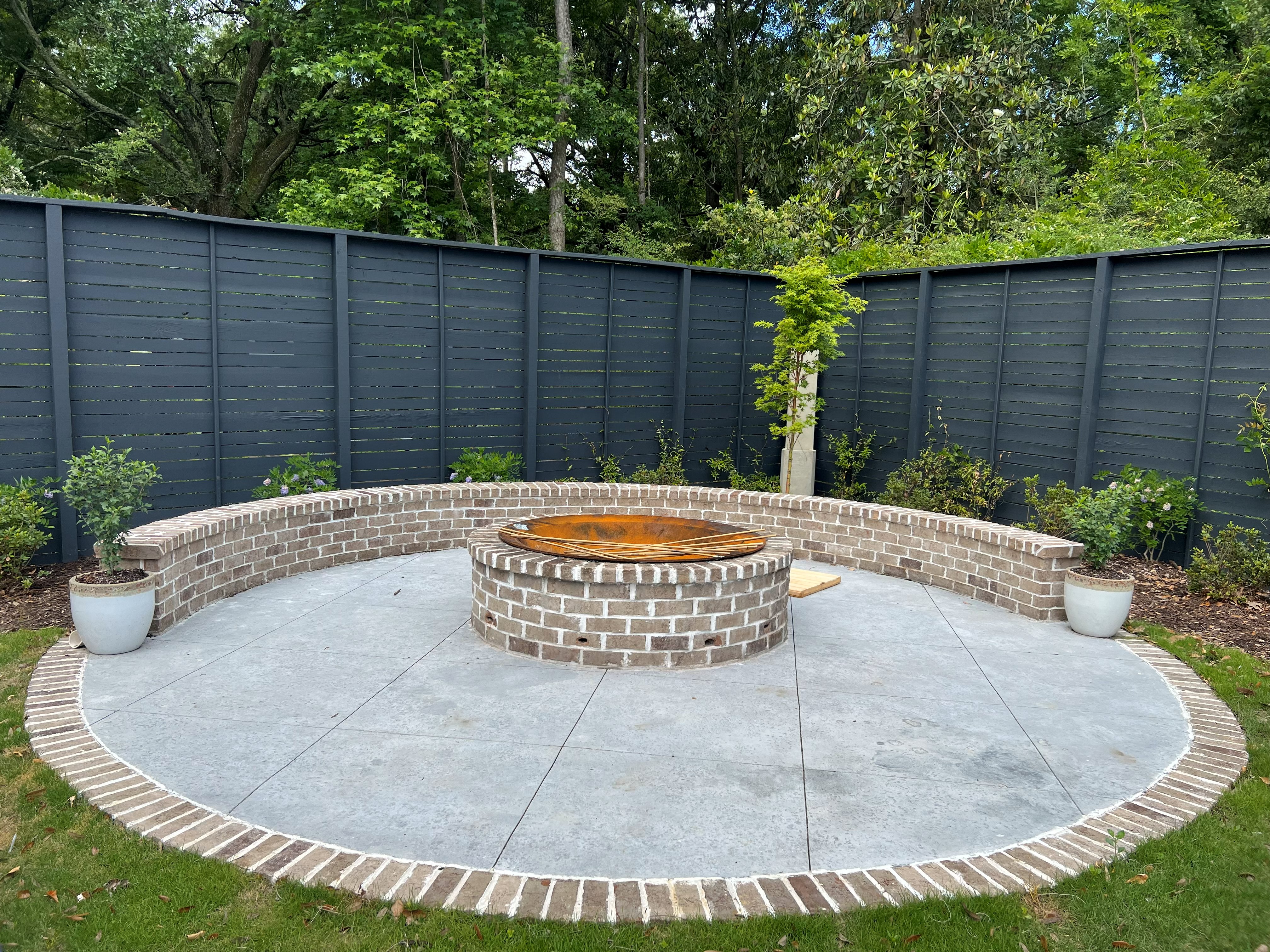 Stained Concrete Basement Charleston - Acid Stain Decorative Flooring Acid stained concrete basement floor in Charleston SC with rich brown and amber tones, reactive chemical staining for variegated color effect, diamond ground surface preparation, penetrating sealer for moisture protection, low maintenance residential flooring, eco-friendly water-based stain, humidity resistant for below-grade applications, modern industrial aesthetic