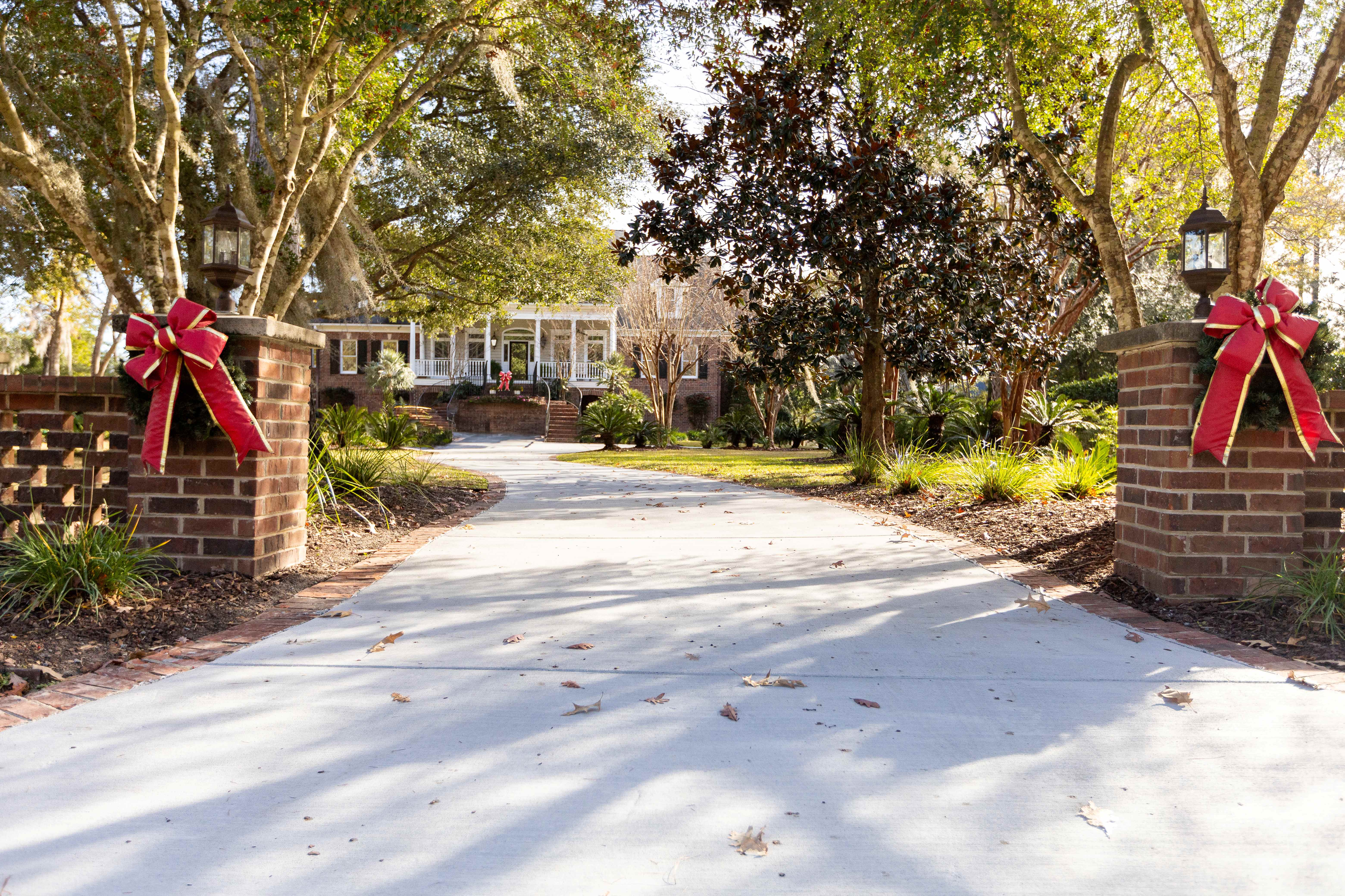 Exposed Aggregate Concrete Driveway - North Charleston SC Exposed aggregate concrete driveway in North Charleston SC showing decorative pebble finish with natural stone aggregate, slip-resistant textured surface, high-strength 4500 PSI concrete mix, proper drainage design, and durable construction for commercial-grade residential use