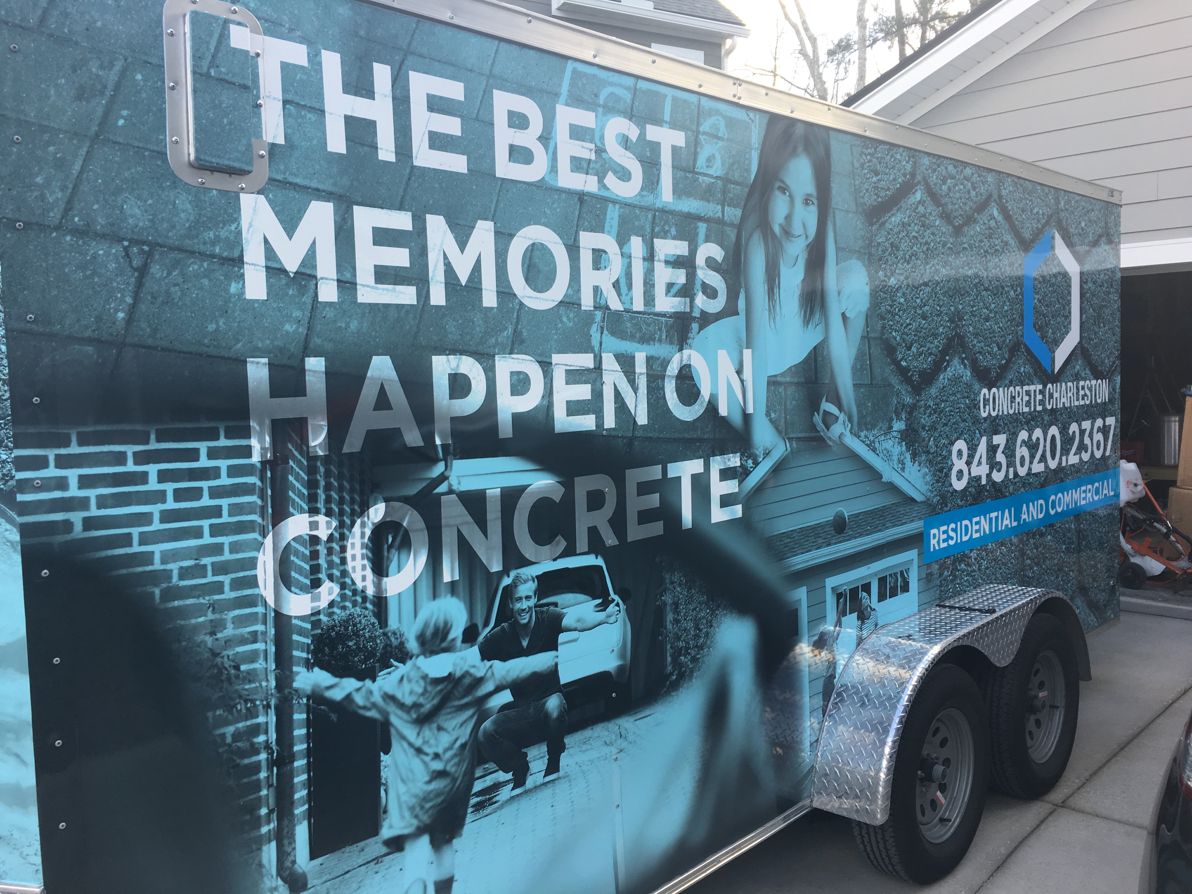 Beautiful stamped concrete patio in Charleston Lowcountry with decorative slate pattern, earth-tone color stain, and sealed finish creating elegant outdoor living space for residential property