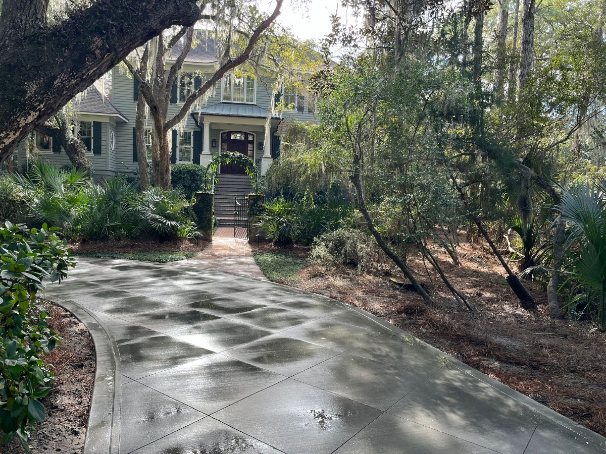 Decorative Concrete Services Charleston SC - Stamped, Stained & Polished Concrete Professional decorative concrete installation in Charleston SC Lowcountry showing stamped concrete patio with natural stone pattern, acid staining in earth tones, high-gloss sealer application, 4000 PSI concrete with integral color, expert craftsmanship with attention to detail, UV-resistant finish for coastal climate, humidity and salt air protection, custom design work for residential and commercial properties