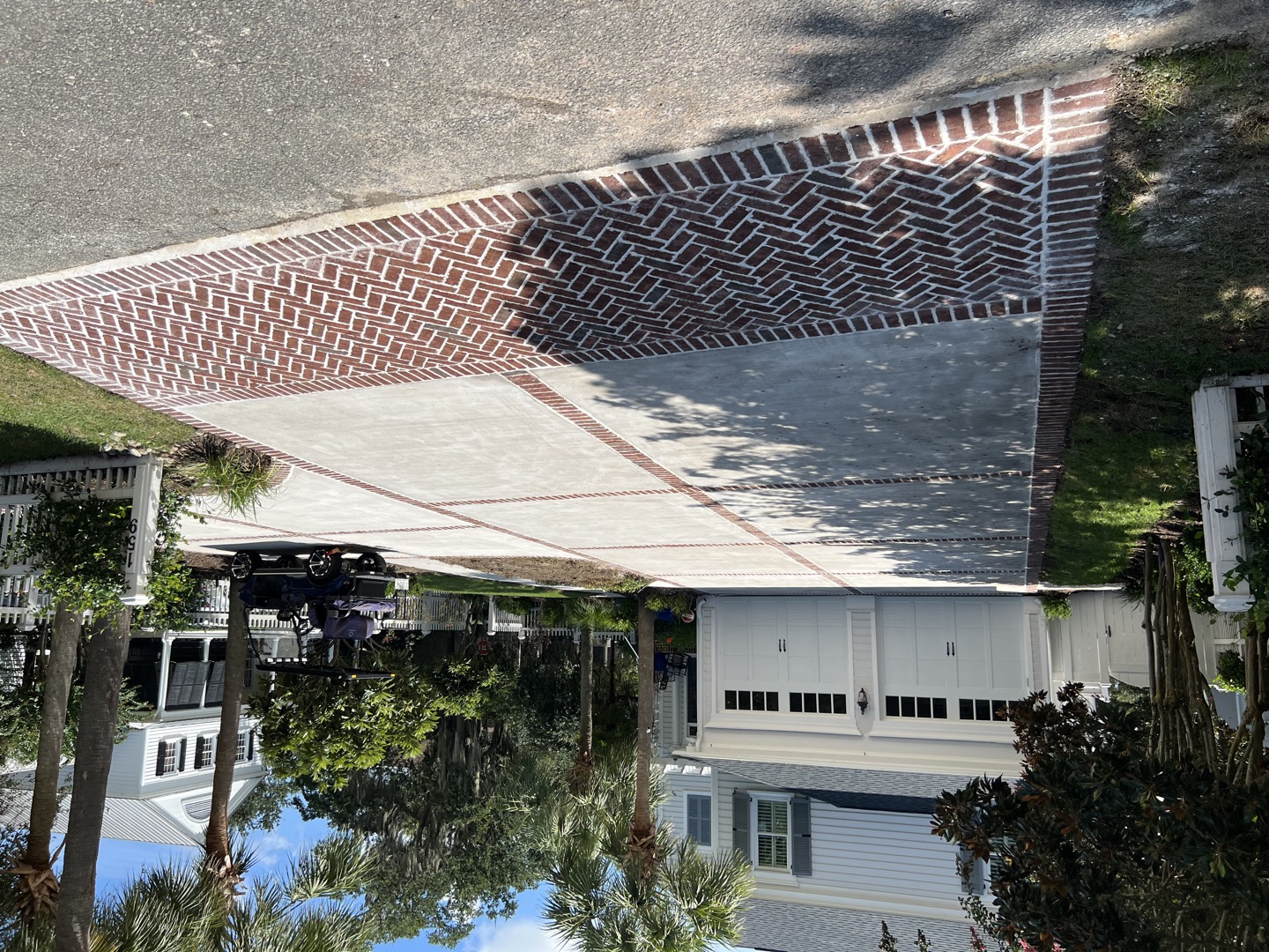 Wood Plank Stamped Concrete Summerville - Realistic Wood Grain Patio Design Wood plank stamped concrete patio in Summerville SC with realistic wood grain texture, integral walnut brown color, hand-carved details for authentic appearance, 4 inch thickness with rebar grid reinforcement, penetrating sealer with matte finish, UV fade resistant, termite-proof alternative to real wood decking, low maintenance outdoor living space for Charleston area homes