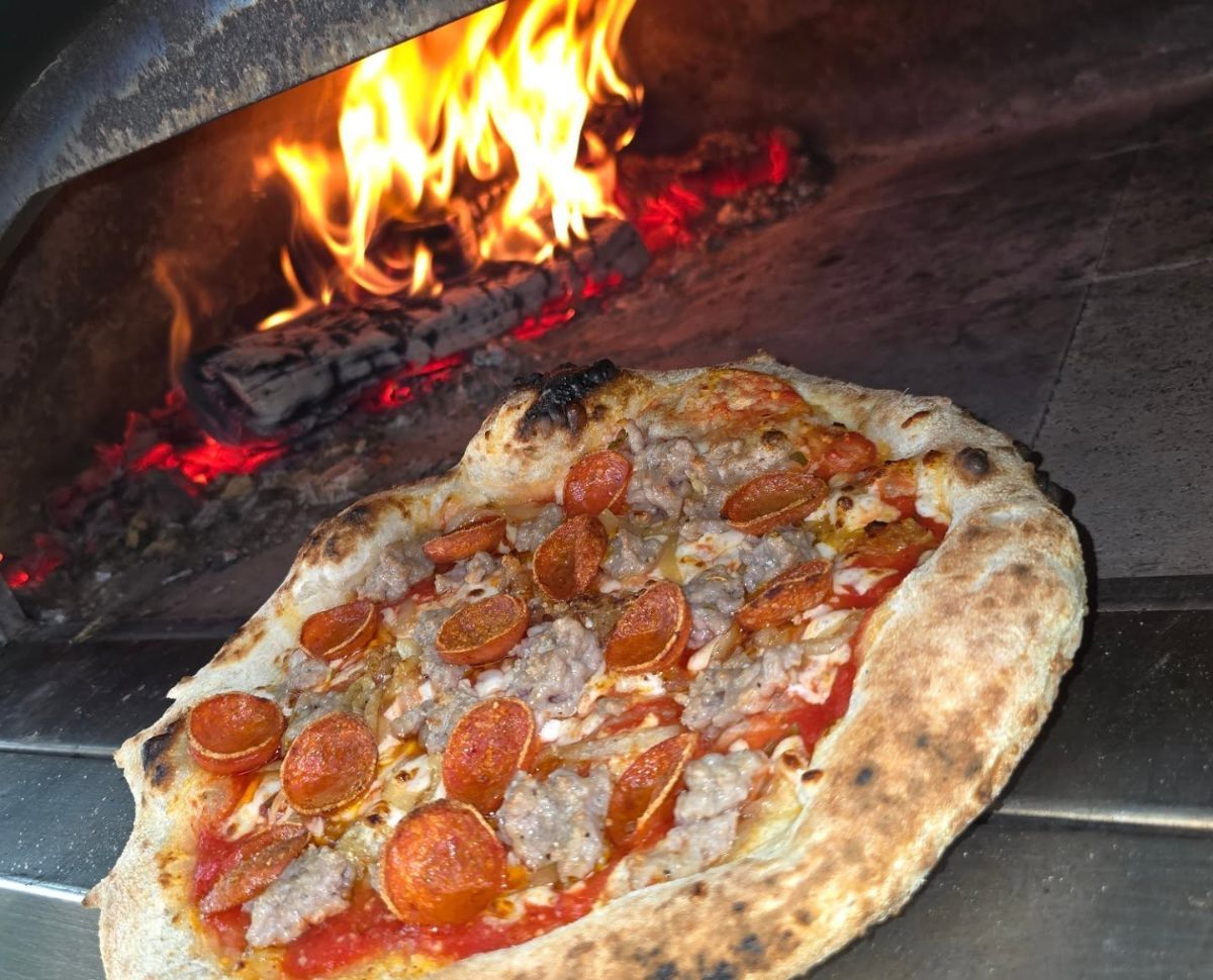 Pizza cooking in wood fire oven