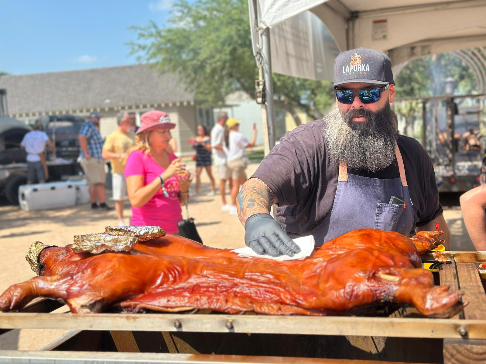 La Porka Nostra Traditional Cuban Lechon Whole Roasted Pig Traditional Cuban lechon whole roasted pig with crispy golden crackling skin on charcoal embers