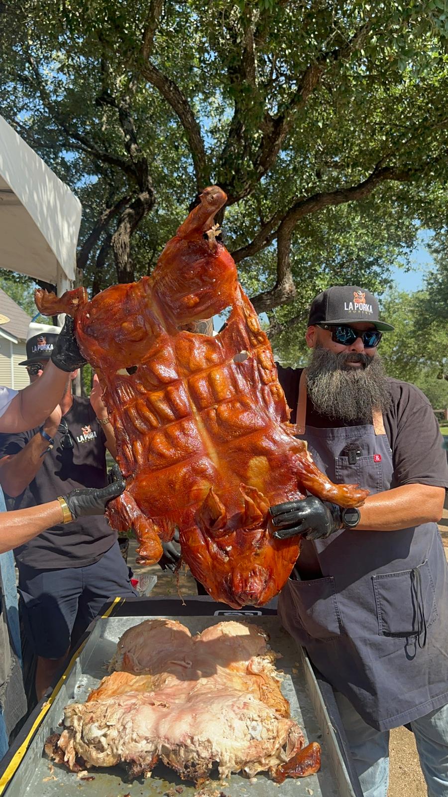 La Porka Nostra Championship BBQ Competition Trophies and Grilling Setup La Porka Nostra BBQ competition trophies and championship fire-lit grilling station
